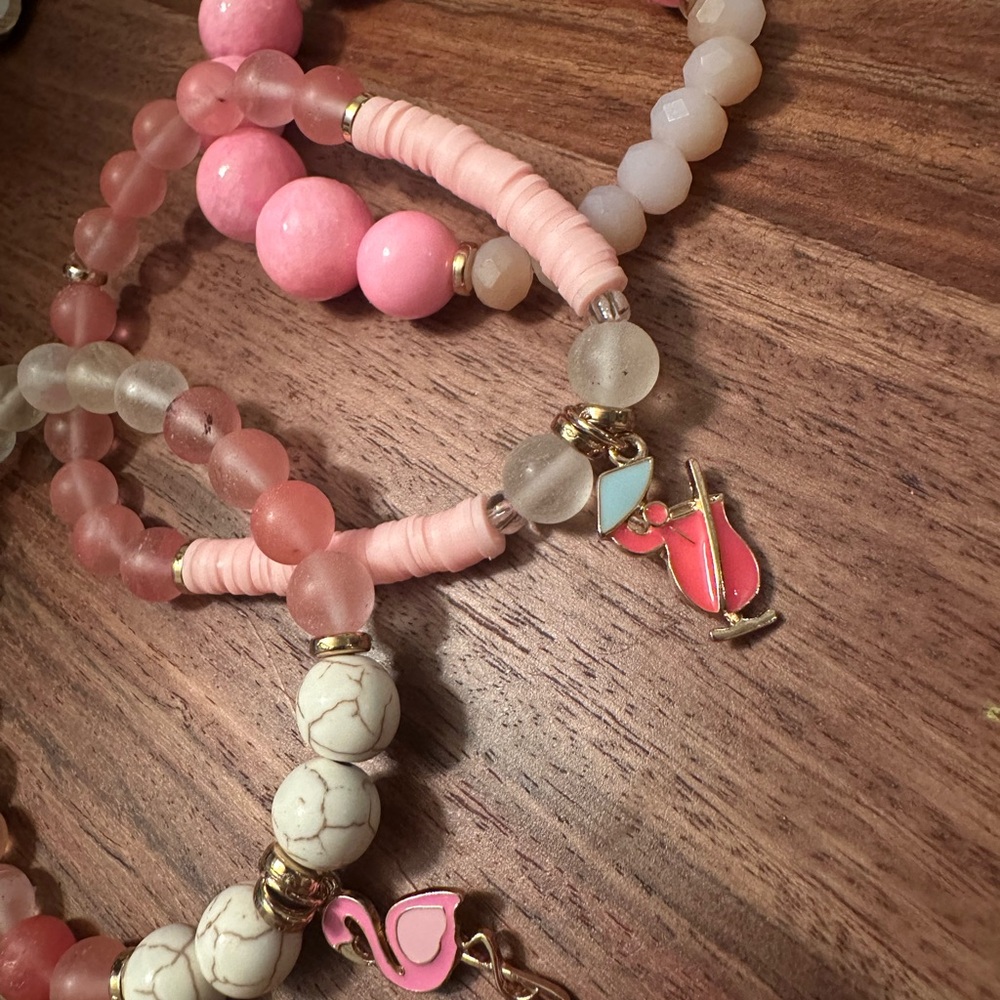 Pink and White Beaded Bracelets with Charms